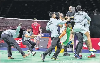  ?? BADMINTONP­HOTO/BWF ?? Indian players celebrate after beating Denmark in the Thomas Cup semi-final in Bangkok on Friday.