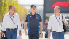  ?? ?? Max Verstappen (centre) walks with manager Ray Vermeulen (left) and father Jos Verstappen in the paddock in Bahrain.