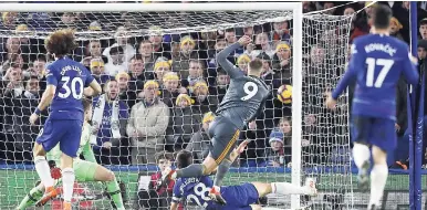  ??  ?? Leicester’s Jamie Vardy scores the winning goal against Chelsea during the English Premier League match at Stamford Bridge stadium in London, yesterday. Leicester won 1-0.