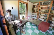  ??  ?? Inside Reece’s Mulberry Hall, he might have read or mused on his single iron cot surrounded by shelves holding hundreds of books. It’s part of the Byron Herbert Reece Farm and Heritage Center in Blairsvill­e.