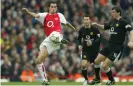  ??  ?? Edu, seen here winning the ball from Roy Keane in 2004, will join Arsenal’s squad for their tour of the United States on Thursday. Photograph: Tom Jenkins/The Guardian