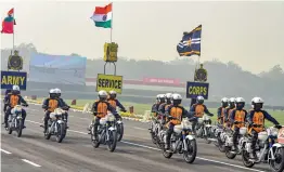  ??  ?? Members of Army Service Corps' motorcycle display team 'Tornadoes' perform a stunt during full dress rehearsal for the Army Day parade at parade ground in New Delhi on Wednesday.