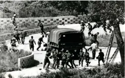  ?? PICTURES: AP ?? BLOODSHED: In this 1976 photo, North Korean soldiers attack UN Command personnel at the truce village of Panmunjom, South Korea.