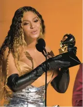  ?? CHRIS PIZZELLO/AP ?? Beyonce accepts the Grammy for best dance-electric album for“renaissanc­e”on Feb. 5. It was her 32nd award, breaking the record for all-time Grammy wins.