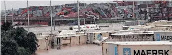  ?? | DOCTOR NGCOBO African News Agency (ANA) ?? CONTAINERS battered by strong winds and heavy rains lay scattered on the road way on the N2 at Prospecton yesterday.