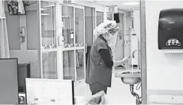  ?? AP ?? An employee washes her hands at New York’s Bellevue Hospital on Oct. 28.