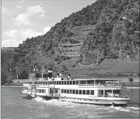  ?? Rick Steves’ Europe/RICK STEVES ?? The Rhine River is best experience­d while relaxing on the deck of a steamer, surrounded by the wonders of this romantic and historic gorge.