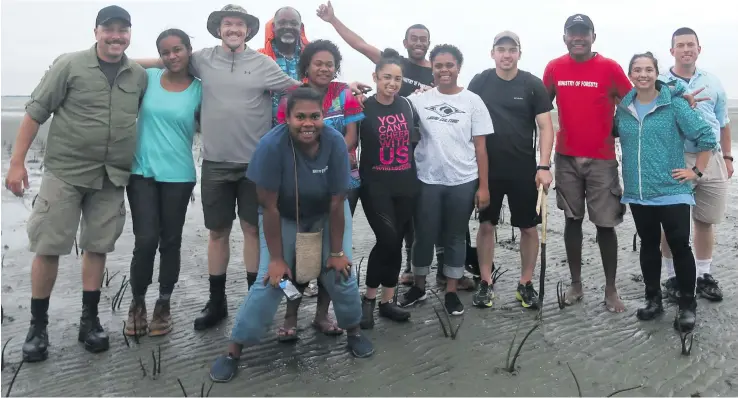  ?? Photo: Wati Talebula ?? Some crew members of the USS Shoup (DDG 86) and forestry officers after planting 10,000 mangrove seedlings at the Nasese foreshore in Suva on October 16, 2018.