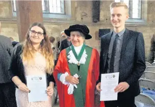  ??  ?? Ashleigh and Sam Wadsworth were admitted to the Guild of Freemen at a special ceremony. They are pictured with the mayor of York