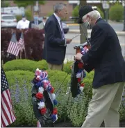  ?? PETE BANNAN - MEDIANEWS GROUP ?? U.S. Army Vietnam veteran Dennis Murphy places a wreath at the Radnor Memorial Day service during a previous year’s ceremony.