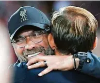  ?? AFP ?? Klopp (links) will Landsmann Tuchel (rechts) heute das Leben schwer machen