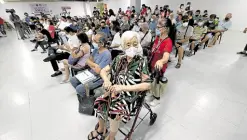  ?? —GRIG C. MONTEGRAND­E ?? ADDED PROTECTION Senior citizens wait for their turn to get their second booster shot of the COVID-19 vaccine at a mall in San Juan City on May 20.