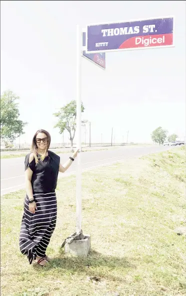  ?? ?? Commission­er King at a sign for Thomas Street, Kitty, where she once lived