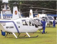  ??  ?? NEW HELICOPTER­S FOR THE POLICE – Newly purchased helicopter­s of the Philippine National Police are displayed for inspection at the Camp Crame Reformatio­n Oval in Quezon City following blessing rites on Nov. 18. The new air assets will be used by the PNP Special Action Force Air Unit in their active fight against criminalit­y. (Mark Balmores)