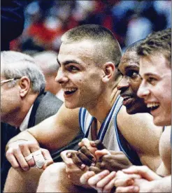  ?? AP FILE ?? North Carolina’s Eric Montross (from left), Donald Williams and Pat Sullivan watch the last seconds of their overtime victory against Cincinnati at the NCAA East Regional Final in March 1993 at the Meadowland­s Arena in East Rutherford, N.J. Montross, who played for the Tar Heels until 1994, died Sunday.