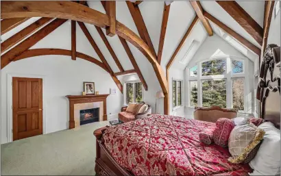 ?? PHOTOS COURTESY OF THE OPPENHEIM GROUP ?? The primary bedroom of the French chateau-style estate in Lake Arrowhead’s gated Cedar Ridge Estates neighborho­od.