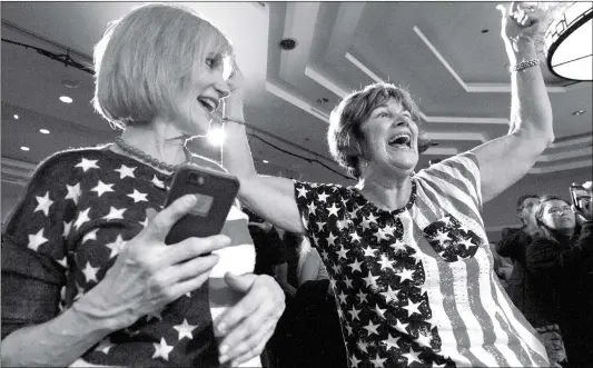  ?? Photo: AFP ?? Karen Magnuson (left) and Karen Shaw celebrate after the announceme­nt of Democratic candidate Jason Crow’s victory in Colorado’s 6th congressio­nal district, at the Colorado Democrats watch party in Denver, Colorado on Tuesday.