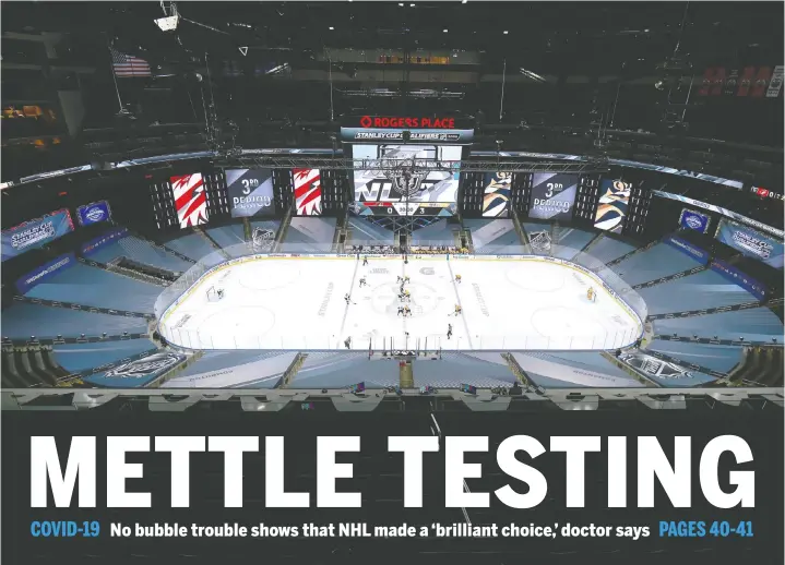  ?? — GETTY IMAGES ?? Minus spectators, Arizona and Nashville face off in Game 2 of the Western Conference qualificat­ion round before the Stanley Cup playoffs, Tuesday in Edmonton.