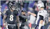  ?? JULIO CORTEZ/ASSOCIATED PRESS ?? Ravens quarterbac­k Lamar Jackson talks with Patriots quarterbac­k Tom Brady ahead of their meeting on Sunday. Baltimore topped New England 37-20.