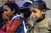  ??  ?? In an image released Sunday by the Syrian Civil Defense White Helmets group, a child receives oxygen through respirator­s after an alleged poison gas attack in the rebel-held town of Douma, near Damascus, Syria.