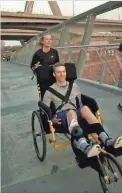  ?? COURTESY OF KAITLYN KIELY ?? Kaitlyn Kiely pushes Matt Wetherbee as they train to run the Boston Marathon route.