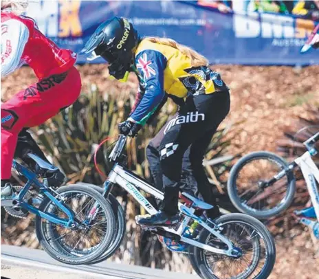  ??  ?? BMX racer Erin Lockwood in action and (below) with coach Justin Lamb. Main picture: DUGGA McLEAN PHOTOGRAPH­Y