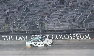  ?? MARK HUMPHREY — THE ASSOCIATED PRESS ?? Chase Elliott does a victory lap after winning the Monster Energy Cup All-Star race July 15at Bristol Motor Speedway in Bristol, Tenn.