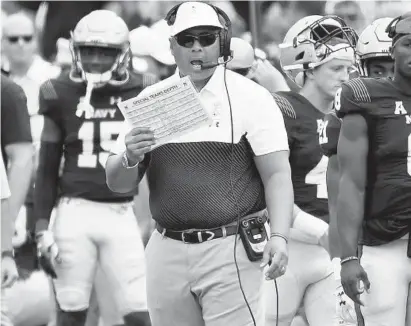  ?? PAUL W. GILLESPIE/CAPITAL GAZETTE ?? Navy head coach Ken Niumatalol­o, shown during a game in 2019, has doubts about the college football season starting as scheduled.