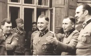  ?? Agence france-presse / Gett
y Images ?? Dr. Josef Mengele, centre, was known as the Angel of Death.