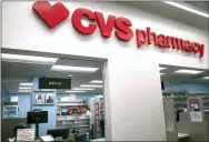  ?? CAROLYN KASTER — THE ASSOCIATED PRESS ?? Pharmacist Evelyn Kim wears a mask and gloves at the CVS pharmacy at a Target on March 17 ub Washington. The Biden administra­tion will begin providing COVID-19 vaccines to U.S. pharmacies.