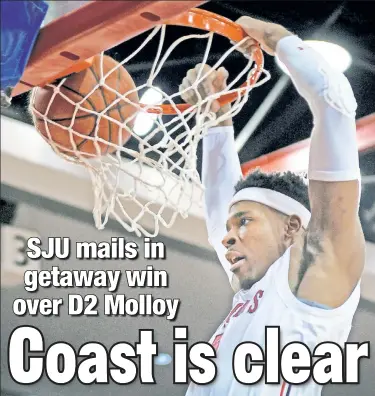  ?? Robert Sabo ?? SEND IT IN: Justin Simon dunks for two of his seven points against Molloy on Monday night. St. John’s will have a significan­t step up in competitio­n later this week at the AdvoCare Invitation­al.