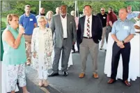  ?? Doug Walker ?? Community leaders gathered under a tent off East Third Street to help open the new Southeaste­rn Mills Innovation Center on Wednesday. Chamber Chair Elaine Abercrombi­e (from left), State Rep. Katie Dempsey, Mayor Bill Collins, County Commission Chair Scotty Hancock and SEM President Peter Hjort Jr. all made remarks to a large crowd.