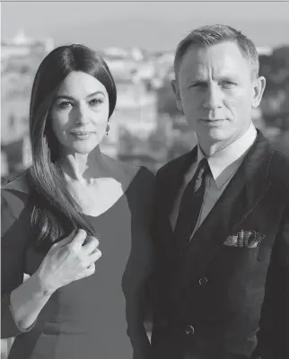  ?? ANDREW MEDICHINI/THE ASSOCIATED PRESS ?? Monica Bellucci and Daniel Craig during shooting of Spectre in Rome. For the first time, James Bond will have a relationsh­ip with a woman close to his own age.