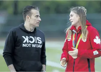  ?? CLIFFORD SKARSTEDT/EXAMINER ?? Broadcaste­r Michael Landsberg, founder of Sick Not Weak, chats with 2016 Canadian Olympic women's rugby bronze medallist Hannah Darling during the fourth annual Friday Night Lights Suicide Awareness Fundraiser on Friday night at Thomas A. Stewart...