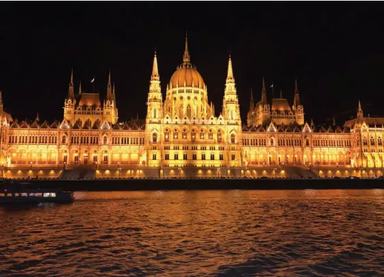  ??  ?? BELOW: The Parliament Buildings of Budapest look almost magical, all lit up at night. Judi Scharf OPPOSITE: The modern, airy suite’s focal point is the large window; the upper piece opens to different positions and can slide down beside the base piece forming a kind of balcony. Crystal Cruises