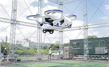  ?? BLOOMBERG ?? A prototype of NEC Corp’s flying car floats in the air during a demonstrat­ion at a testing site of the company’s plant in Abiko, Chiba Prefecture, Japan yesterday.