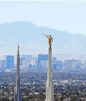  ?? AP ?? An Angel Moroni statue stands atop a spire on the Las Vegas Nevada Temple overlookin­g the Las Vegas Strip on Thursday. Air pollution in Las Vegas ranks among the worst in the country, according to a new report.