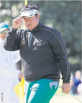  ??  ?? Kiradech Aphibarnra­t reacts after a shot on the first hole.
