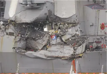  ?? Eugene Hoshiko / Associated Press ?? Damage to the destroyer Fitzgerald is seen at the Yokosuka naval base, home of the Navy’s Seventh Fleet.