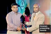  ??  ?? Gnanam presenting awards