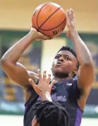  ?? JOE RONDONE/THE COMMERCIAL APPEAL ?? Christian Brothers’ Chandler Jackson shoots the ball during his team’s January 2020 game at Briarcrest Christian School.