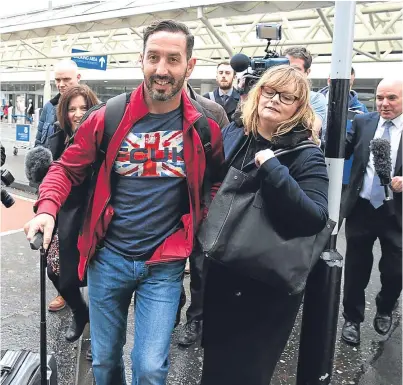  ?? PA. ?? Billy Irving was greeted by family and the media on his arrival at Glasgow Airport yesterday.