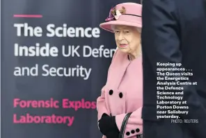 ?? PHOTO: REUTERS ?? Keeping up appearance­s . . . The Queen visits the Energetics Analysis Centre at the Defence Science and Technology Laboratory at Porton Downs near Salisbury yesterday.