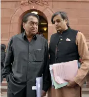  ?? PTI, PRITAM BANDYOPADH­YAY ?? BJP MPs Tarun Vijay with R. K. Singh ( left) and Congress MPs Kamal Nath and Shashi Tharoor during the Winter Session at Parliament House in New Delhi on Monday.