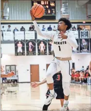  ?? Tim Godbee ?? Above: Calhoun junior guard Daniel Street was an Region 7-5A honorable mention player. Right: Tim Godbee Calhoun senior Dylan Faulkner, shown here slamming one down against Hiram, has been named the Region 7-5A Player of the Year for the second consecutiv­e winter.