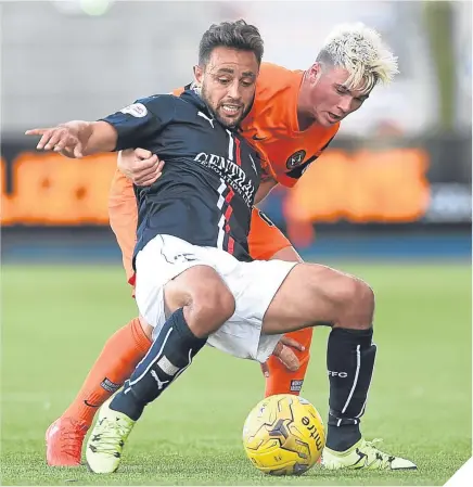  ??  ?? Falkirk’s Tom Taiwo and United’s Jamie Robson battle for ball.