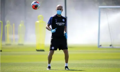  ??  ?? Pep Guardiola takes Manchester City training in a mask as Premier League clubs prepare for the season to restart. Photograph: Tom Flathers/Manchester City FC/Getty Images