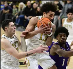  ?? CLIFF GRASSMICK — DAILY CAMERA ?? Colorado’s J’vonne Hadley grabs a rebound against the Washington Huskies last season in Boulder.