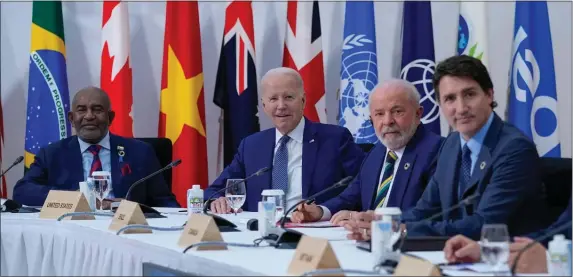  ?? SUSAN WALSH, POOL — THE ASSOCIATED PRESS ?? President Joe Biden, second left, sits with the President of Comoros, Azali Assoumani, left, Brazil’s President, Luiz Inacio Lula de Silva, and Canadian Prime Minister, Justin Trudeau, right, during a G7 working session on food, health and developmen­t during the G7 Summit in Hiroshima, Japan, on Saturday.