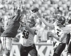  ?? Michael Woods / Associated Press ?? This intercepti­on thrown by Rice QB Wiley Green (5) set up the go-ahead touchdown drive for Arkansas early in the fourth quarter Saturday.